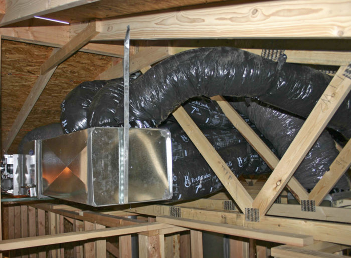 Insulated HVAC ductwork and air-handling equipment installed in a residential attic